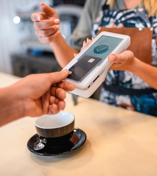Customer making card payment on a Clover card machine terminal